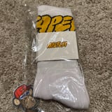 Apefest Crew Socks — sealed in packaging
